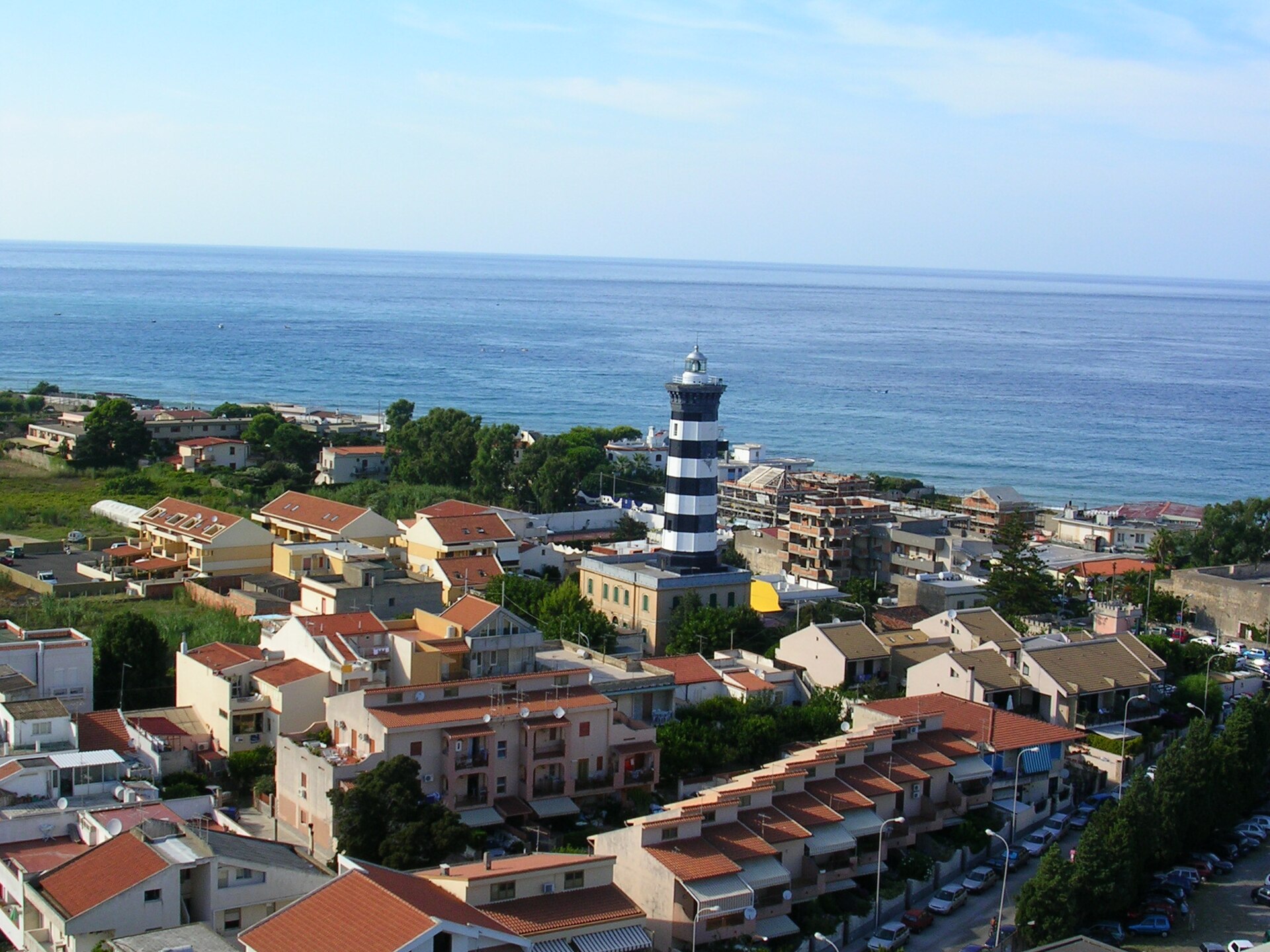 The black-and-white lighthouse of Capo Peloro, Torre Faro
